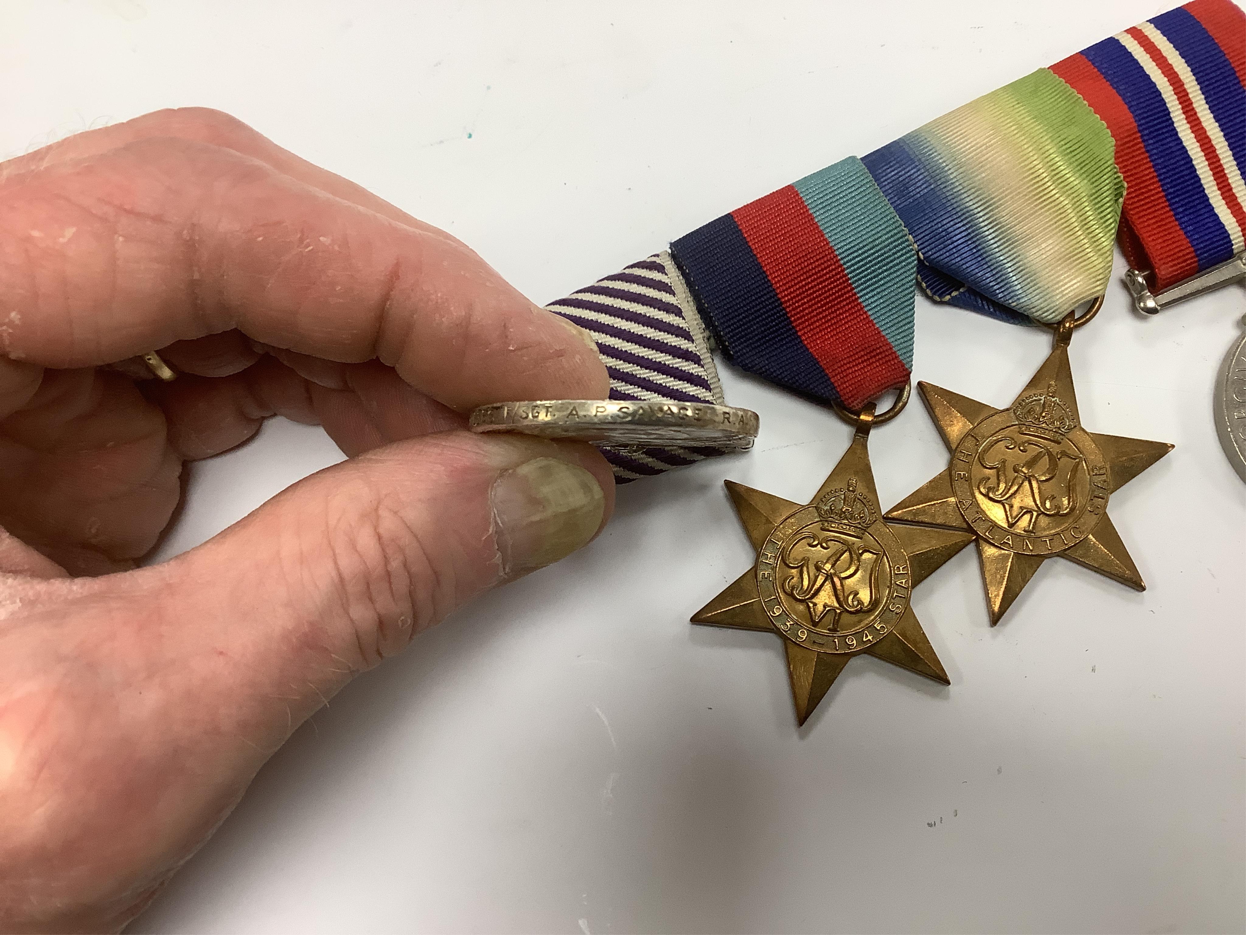 A Distinguished Flying Medal group awarded to Flight Sergeant A. Savage, comprising of the Distinguished Flying Medal together with the Atlantic Star, the 1939-1945 Star and the War Medal